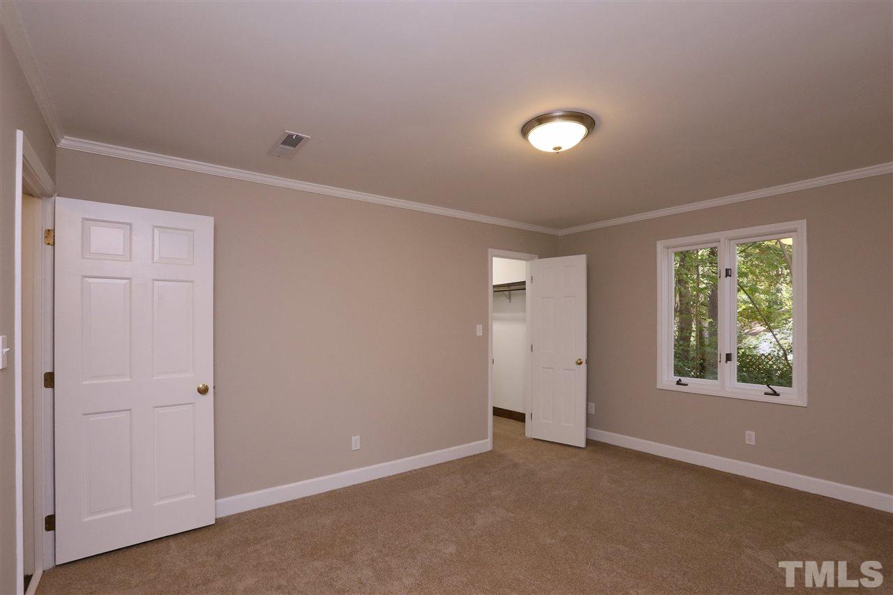 3109 Rutledge Court Raleigh, NC 27613 - Photo 13 of 25 an empty room with windows and closet