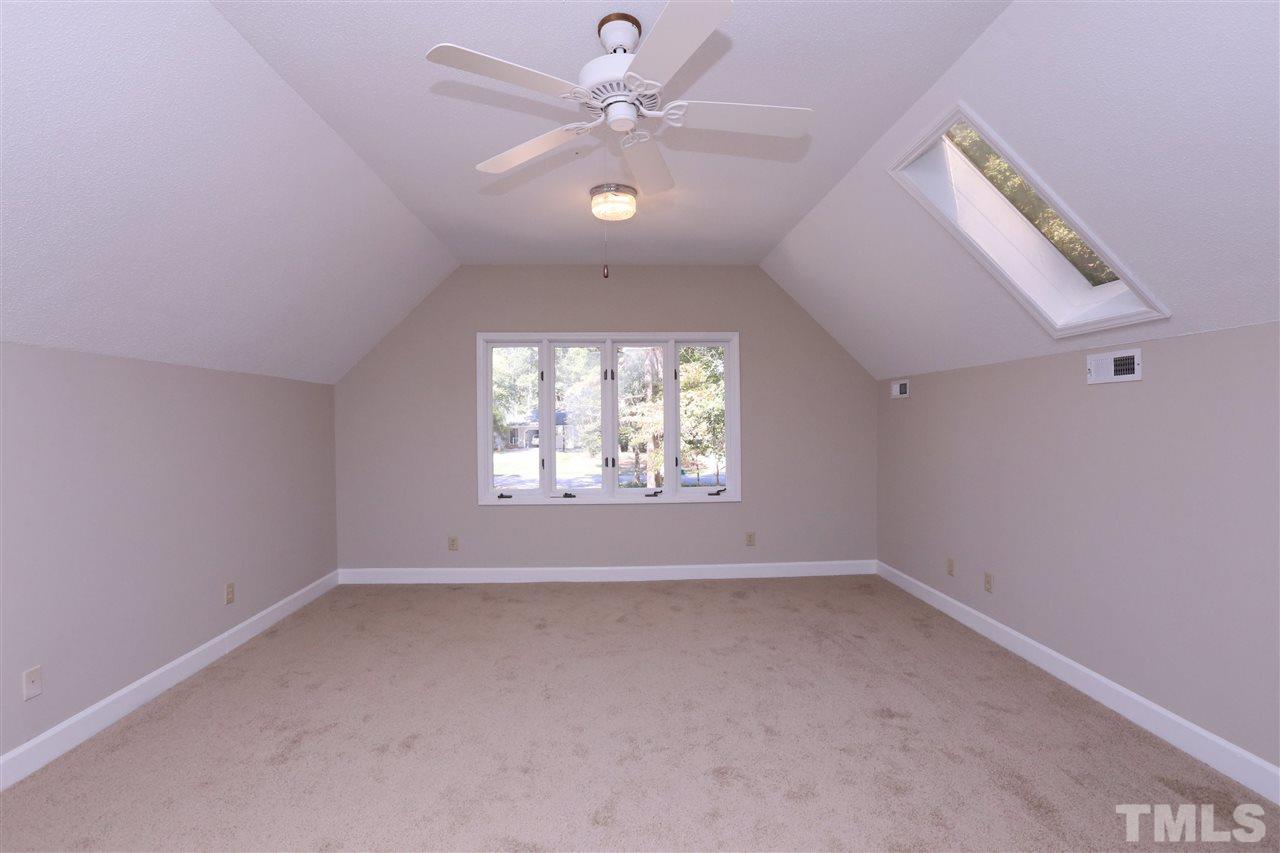 3109 Rutledge Court Raleigh, NC 27613 - Photo 19 of 25 an empty room with a window and a fan