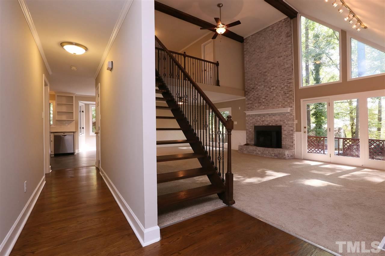 3109 Rutledge Court Raleigh, NC 27613 - Photo 3 of 25 a view of a hallway with wooden floor and staircase