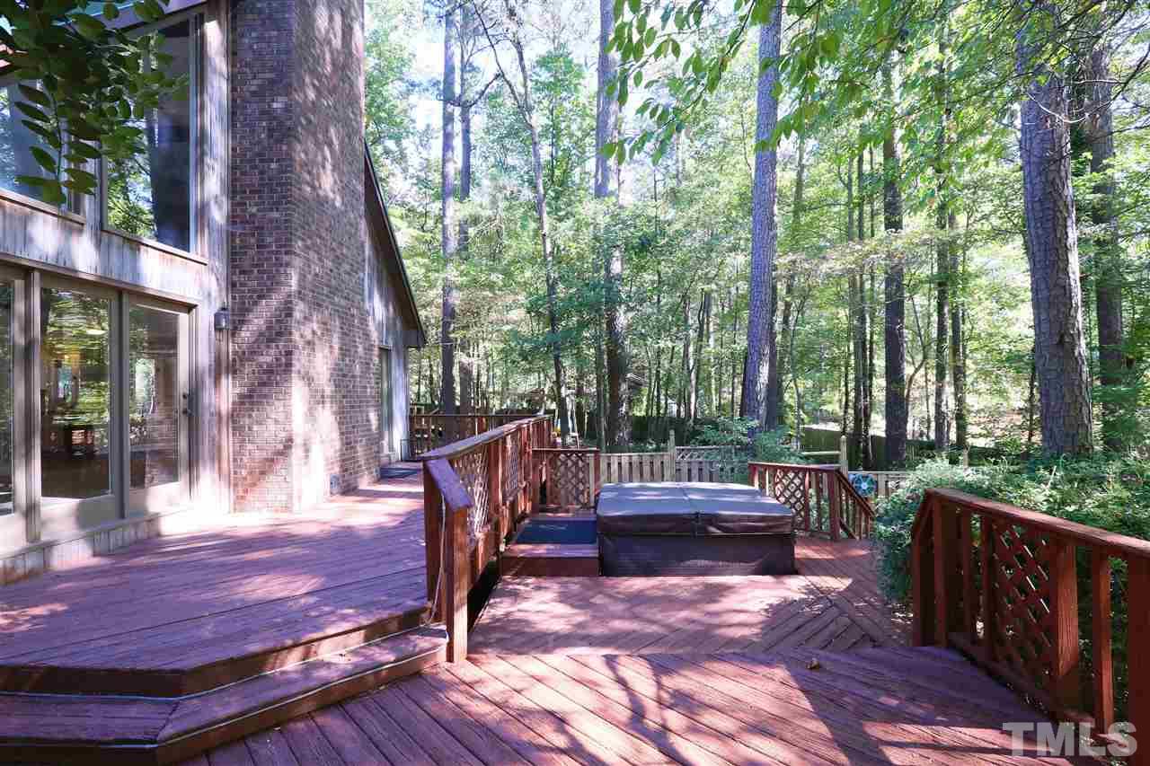 3109 Rutledge Court Raleigh, NC 27613 - Photo 22 of 25 a view of a patio with a table chairs and a backyard