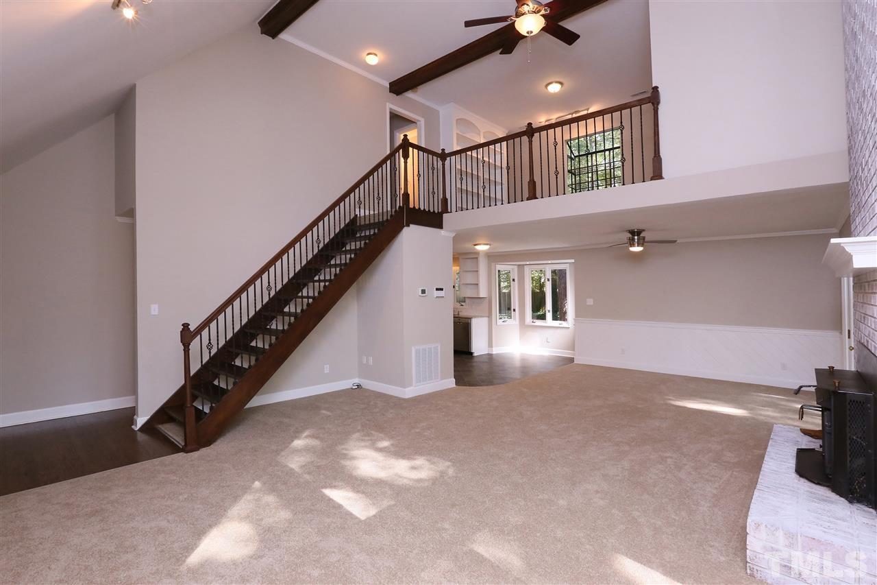 3109 Rutledge Court Raleigh, NC 27613 - Photo 5 of 25 a view of a hallway with stairs