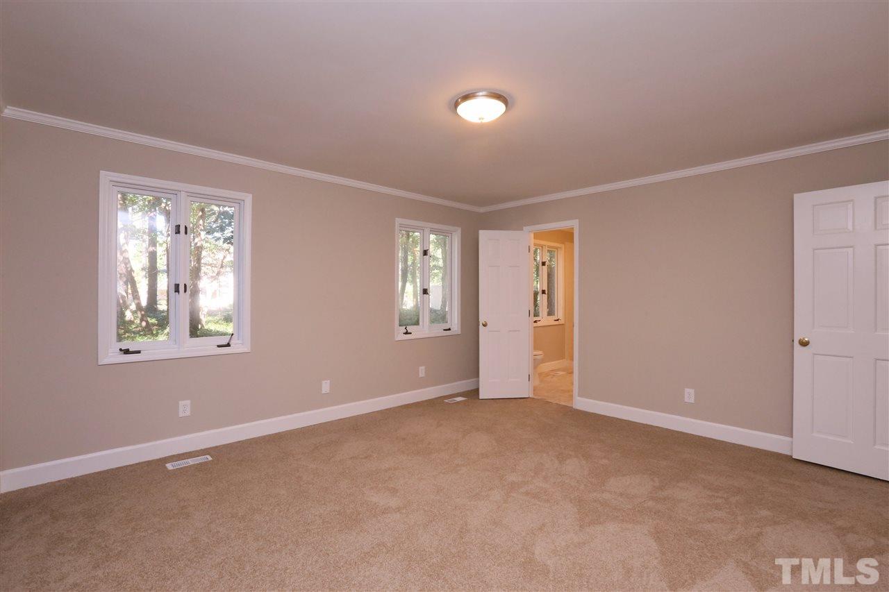 3109 Rutledge Court Raleigh, NC 27613 - Photo 10 of 25 an empty room with windows and closet