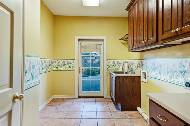 a utility room with cabinets
