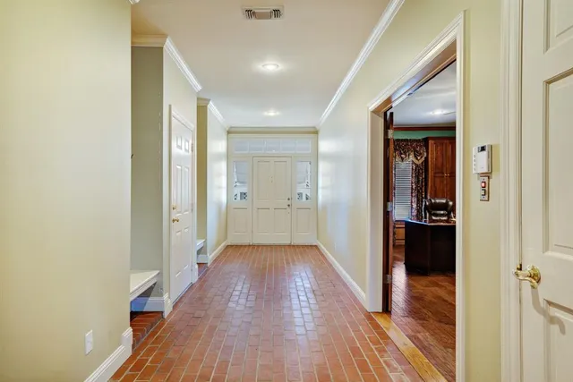 a view of a porch with a floor to ceiling window and a yard