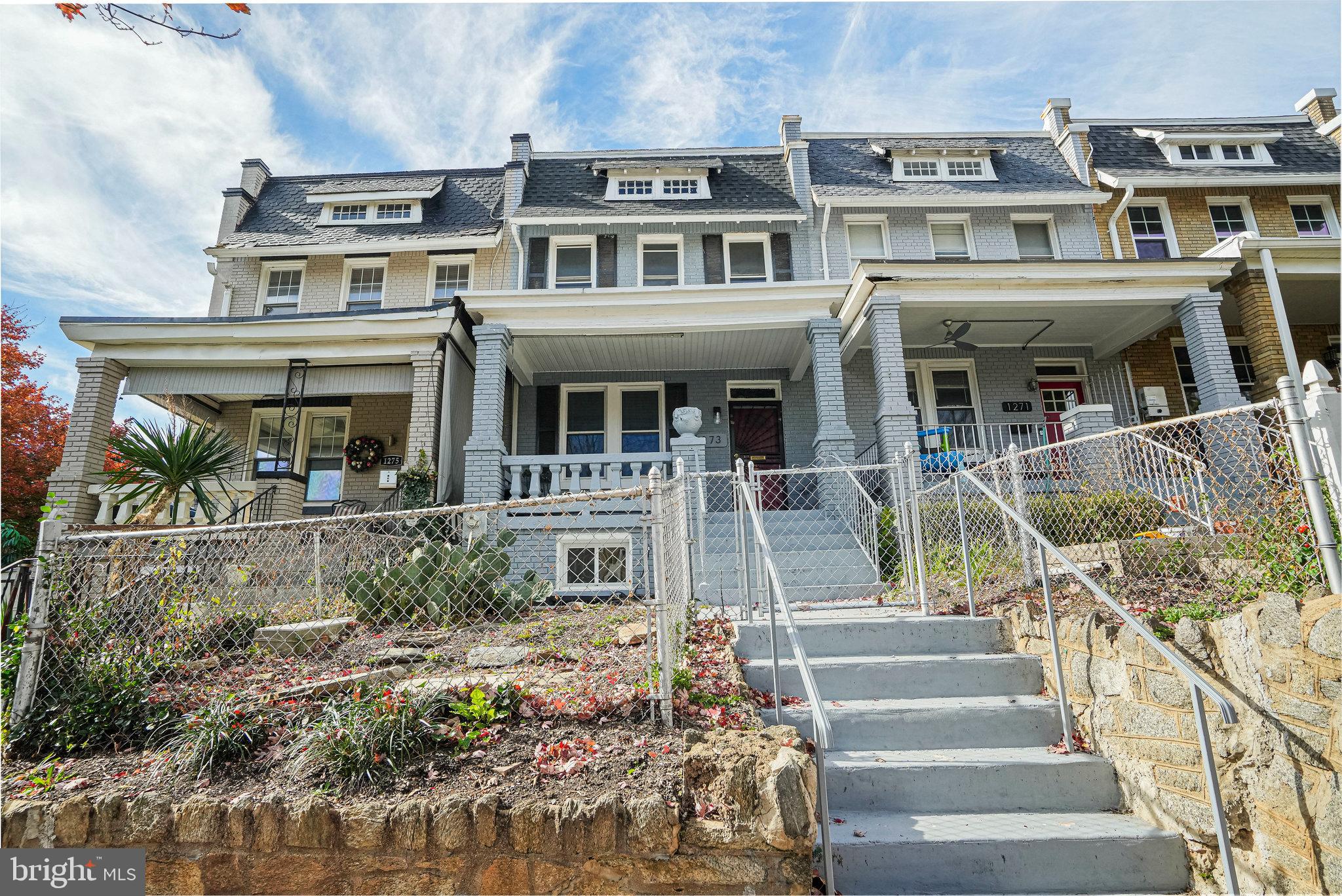 a front view of a house with a porch