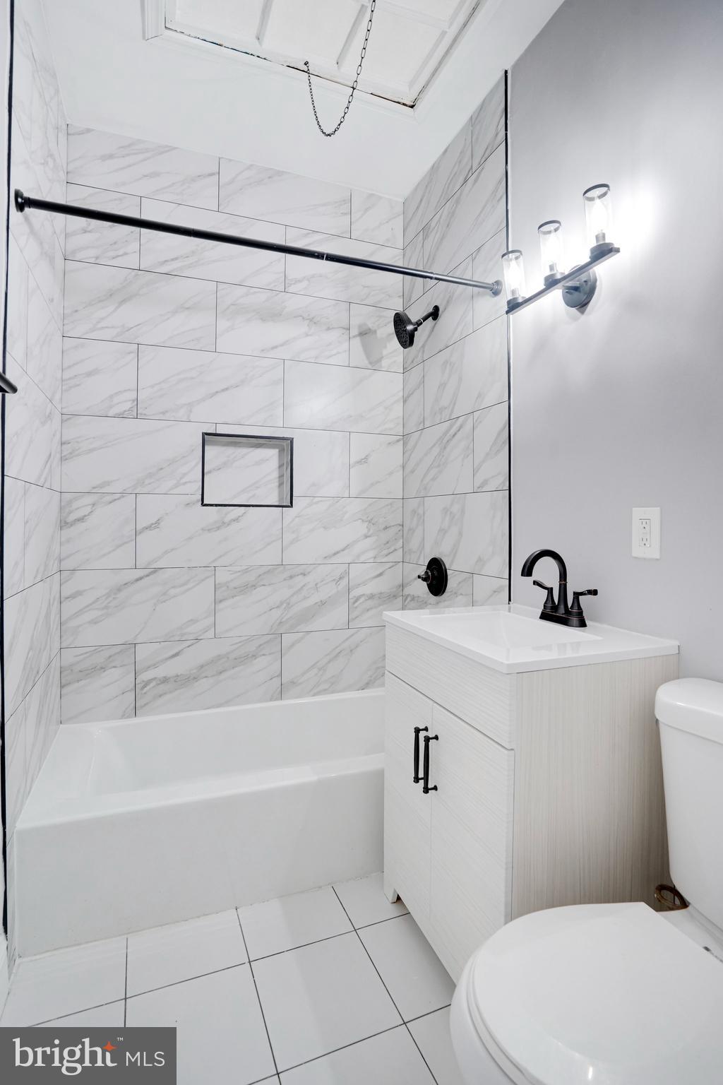 1273 Holbrook Terrace Northeast Washington, DC 20002 - Photo 17 of 24 a bathroom with a sink a toilet and shower