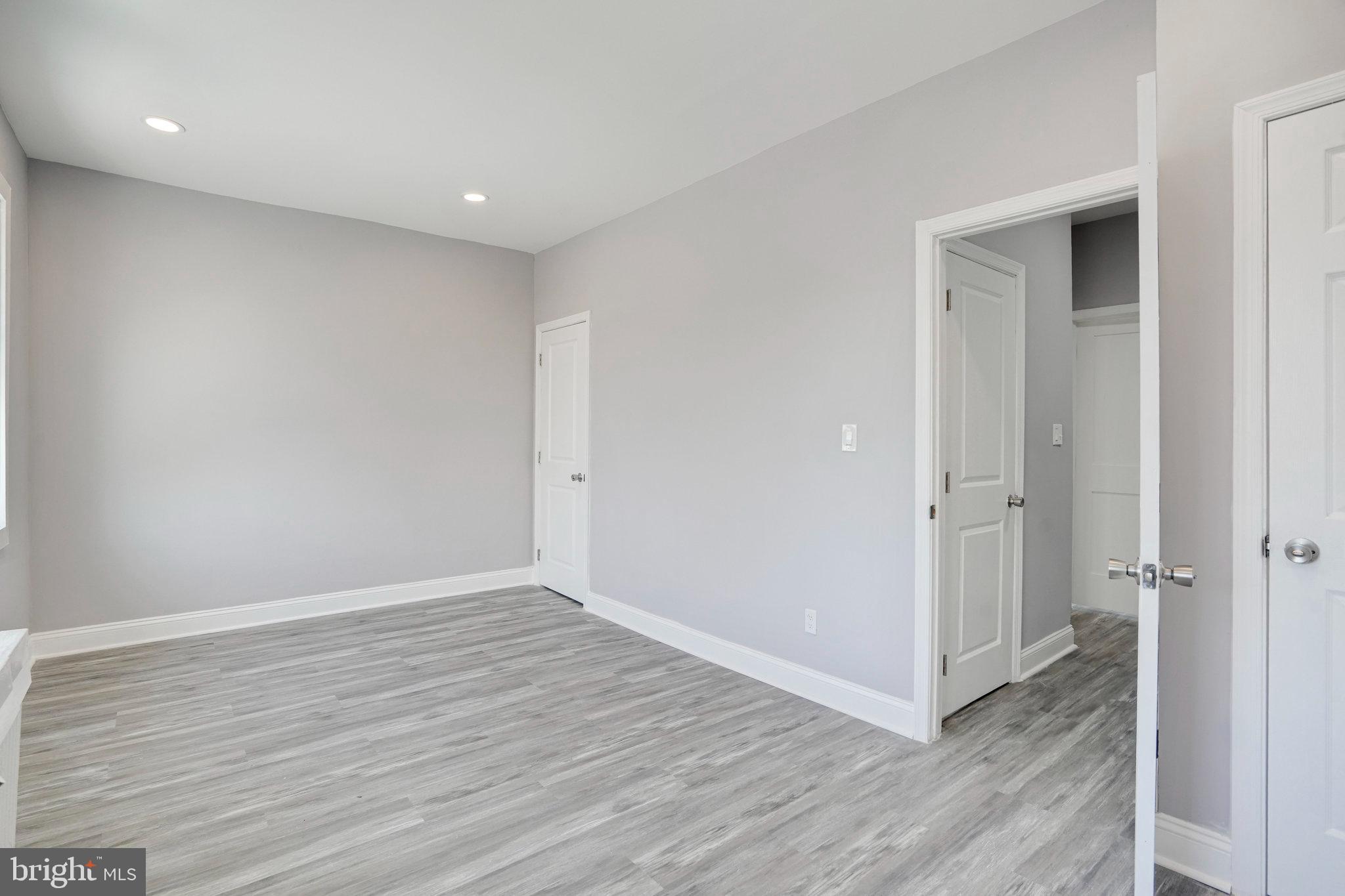 1273 Holbrook Terrace Northeast Washington, DC 20002 - Photo 19 of 24 an empty room with wooden floor and entrance