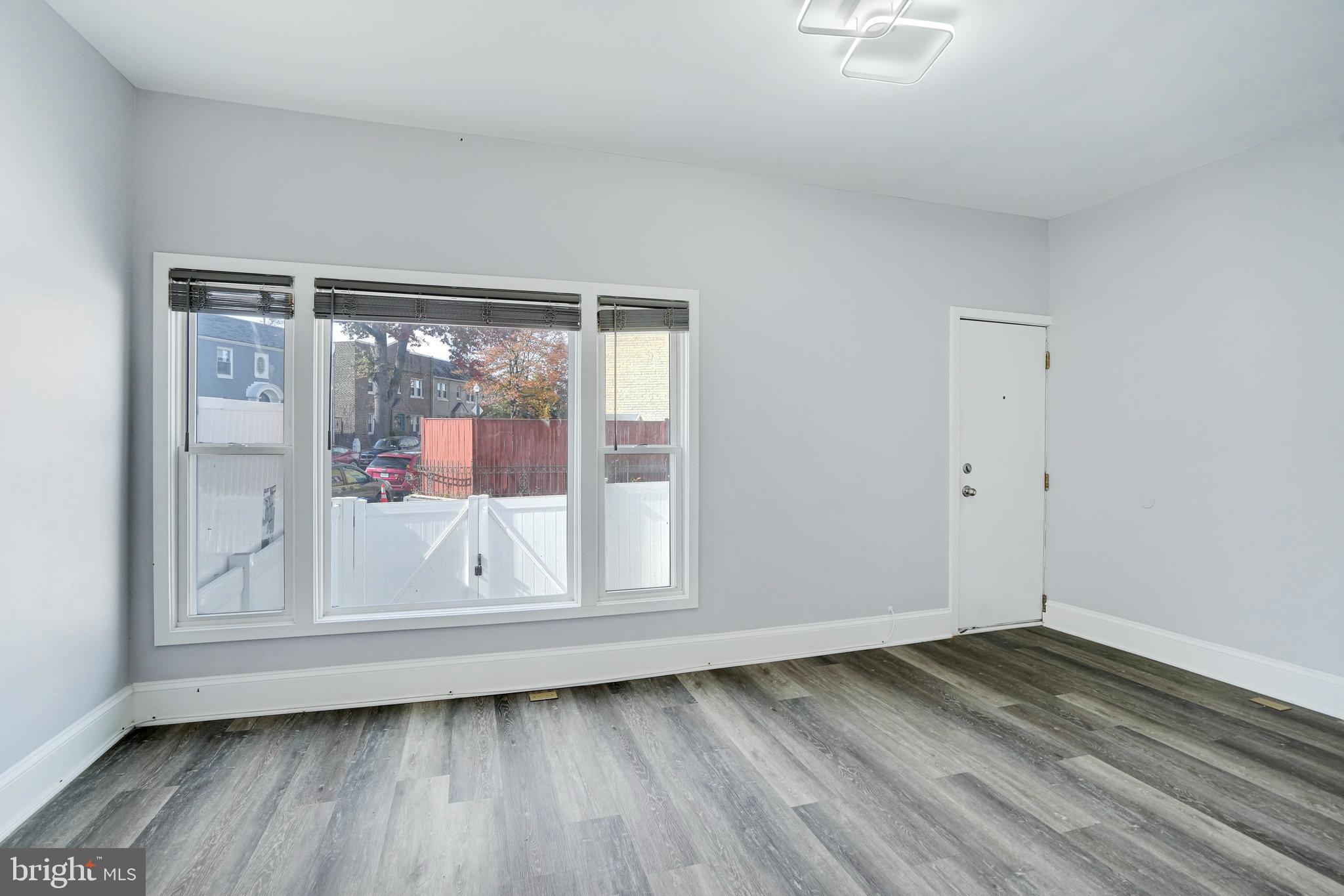 1273 Holbrook Terrace Northeast Washington, DC 20002 - Photo 10 of 24 a view of empty room with wooden floor and fan