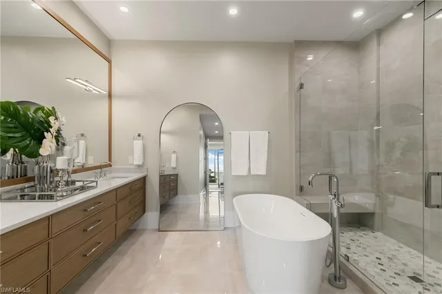 a bathroom with a sink a vanity and a mirror