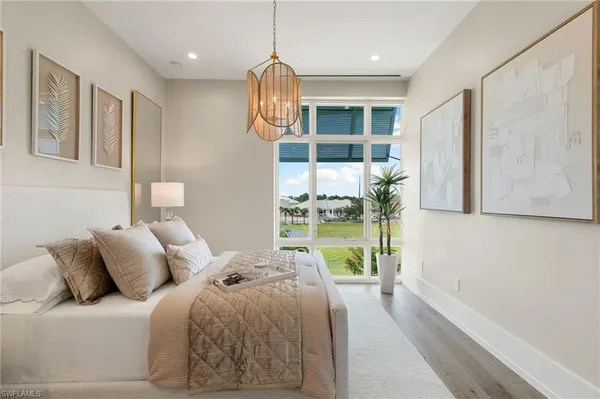 a living room with furniture and a mirror