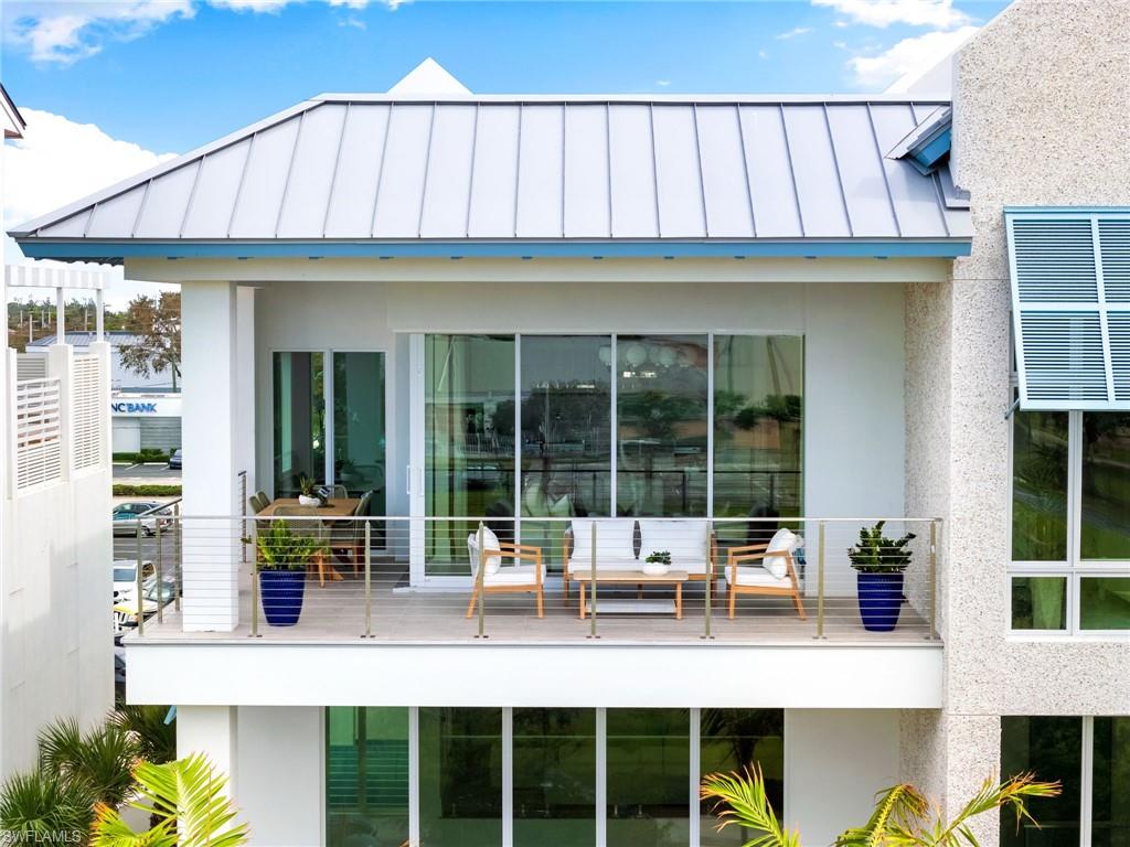 201 8th Street South, Unit 301 Naples, FL 34102 - Photo 30 of 43 a view of building with an outdoor space