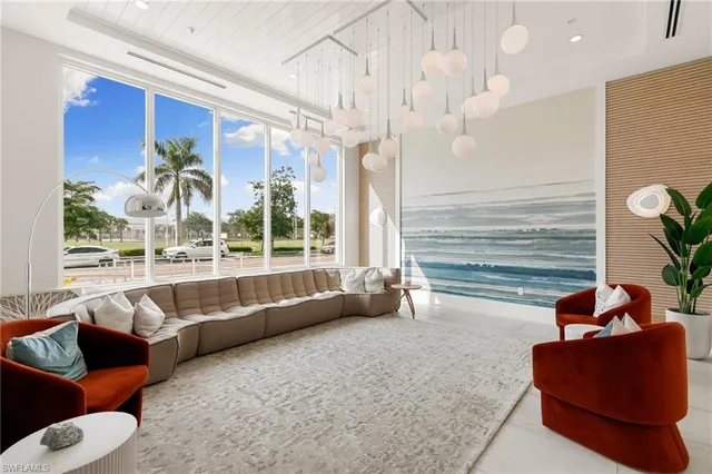 a front view of a building with a garden and plants