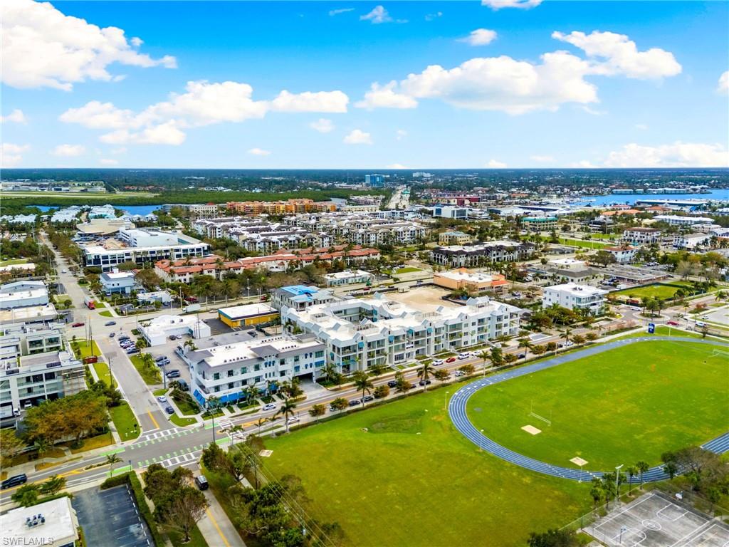 201 8th Street South, Unit 301 Naples, FL 34102 - Photo 42 of 43 an aerial view of residential houses with outdoor space