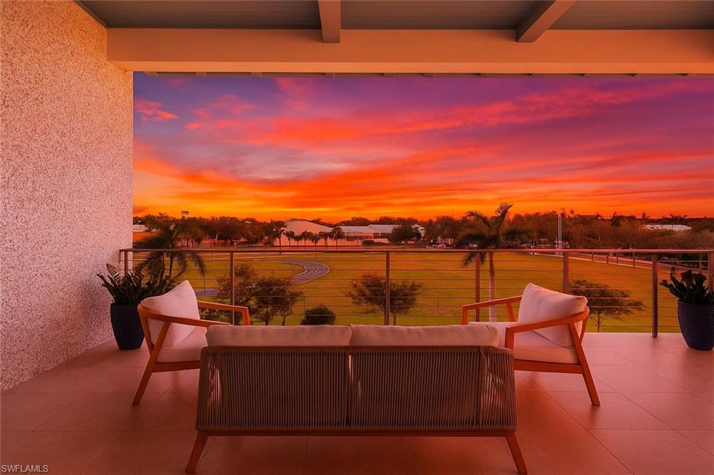 201 8th Street South, Unit 301 Naples, FL 34102 - Photo 10 of 43 a view of a lake with couches and city view