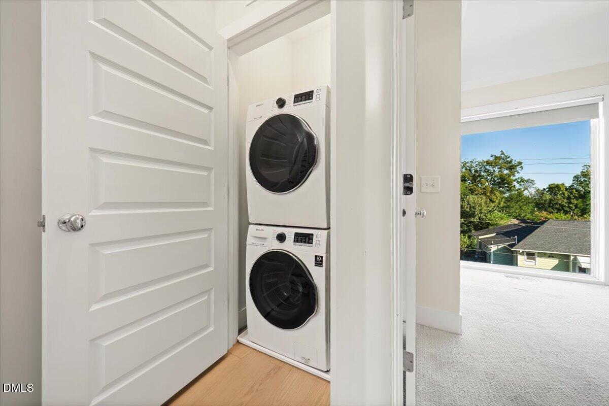 712 East Edenton Street, Unit 102 Raleigh, NC 27601 - Photo 14 of 17 a view of a hallway with washer and dryer