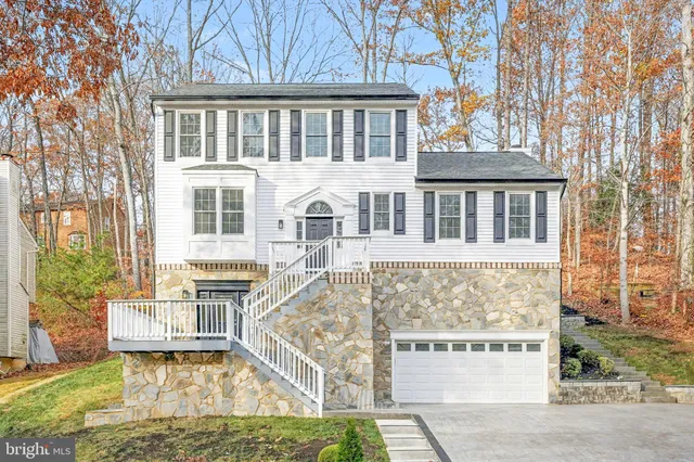 a front view of a building with a garden