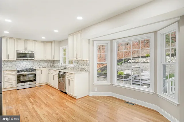a utility room with a sink dryer and washer