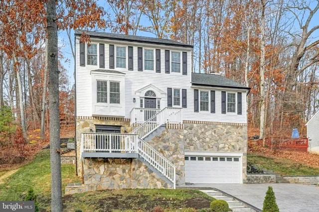 a front view of a building with a garden