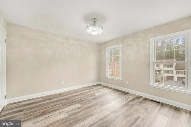 a bathroom with a sink toilet vanity and shower