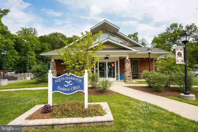 a view of a back yard of the house and front view of a house