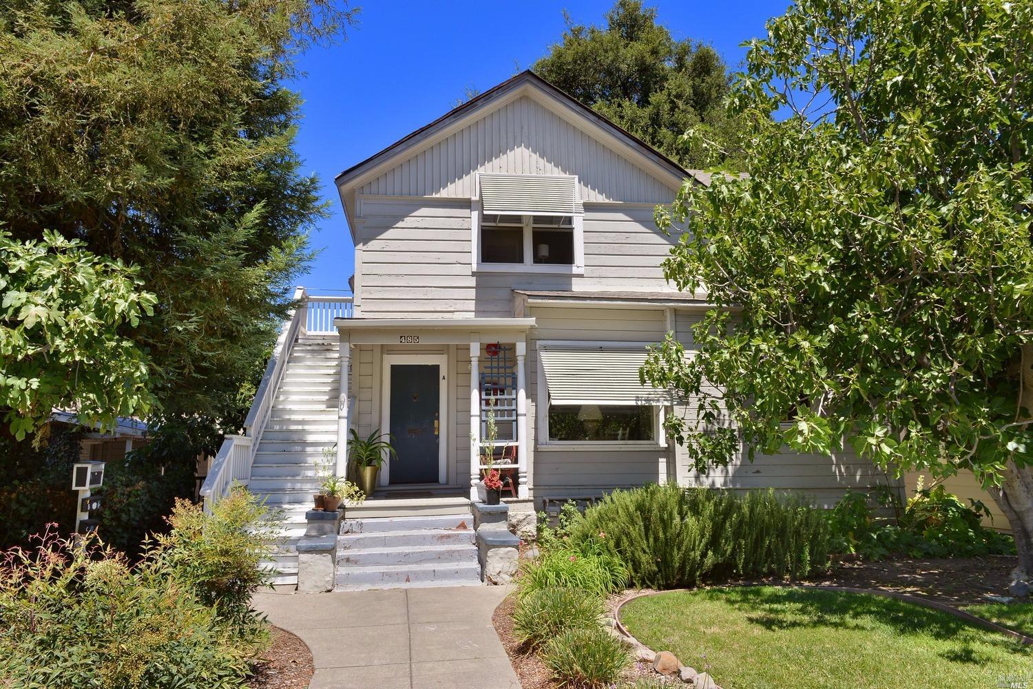 485 Benton Street Santa Rosa, CA 95401 - Photo 1 of 1 Elegant turn of the century Victorian with restrained style. Window on second floor is front bedroom for Unit "C". Door on ground floor is Unit "A". Staircase goes to Unit "C". Twin fig trees flank home and one large redwood tree to the left. Nicely landscaped. Would make a great transformation to an owner occupied home.