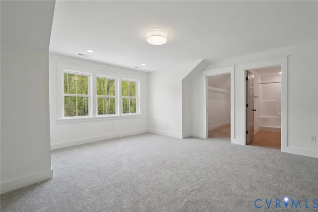 a bathroom with a granite countertop toilet