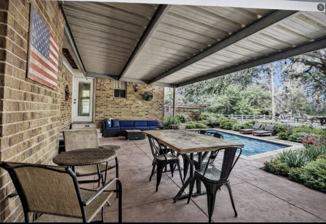 40610 Mill Creek Road Magnolia, TX 77354 - Photo 24 of 31 This is a virtual rendering with a pool added so you can see a nice patio pool will make this backyard your oasis. AI added pool and shrubbery only.