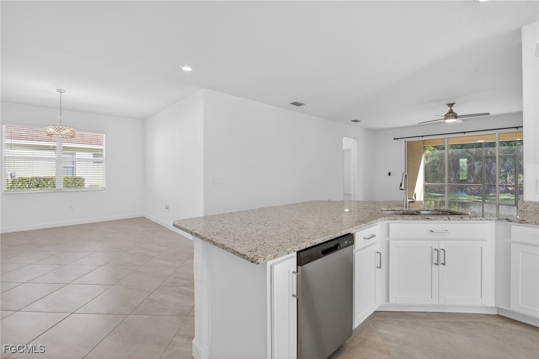 17364 Walnut Run Drive Alva, FL 33920 - Photo 22 of 50 a kitchen with granite countertop white cabinets and a sink