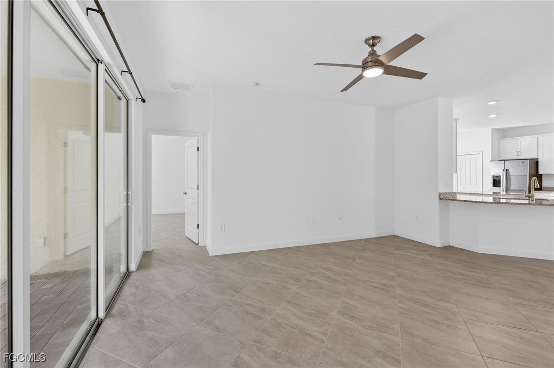 17364 Walnut Run Drive Alva, FL 33920 - Photo 26 of 50 a view of empty room with wooden floor and ceiling fan