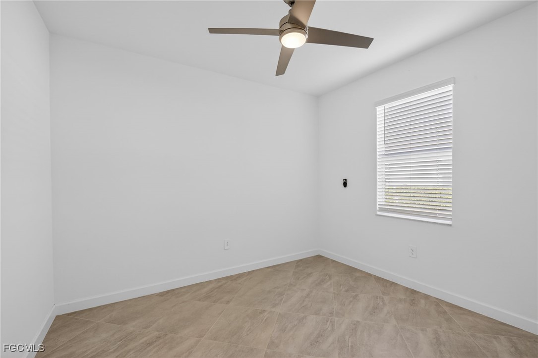 17364 Walnut Run Drive Alva, FL 33920 - Photo 32 of 50 an empty room with a window and a fan