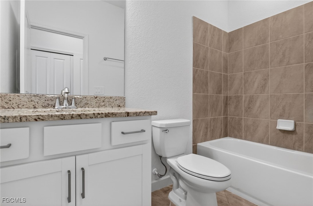 17364 Walnut Run Drive Alva, FL 33920 - Photo 35 of 50 a bathroom with a sink toilet vanity and bathtub