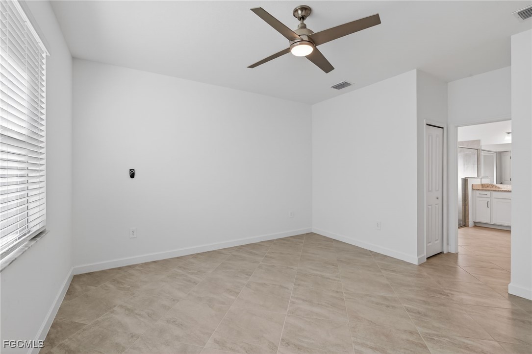 17364 Walnut Run Drive Alva, FL 33920 - Photo 37 of 50 wooden floor in an empty room with a window