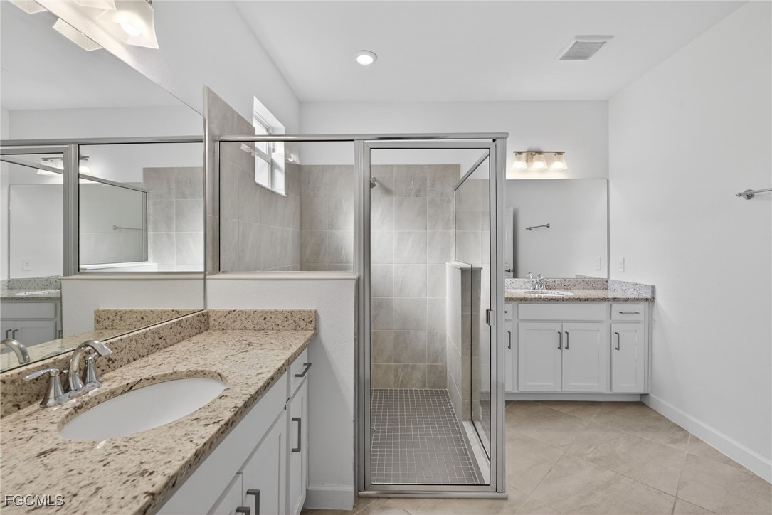 17364 Walnut Run Drive Alva, FL 33920 - Photo 39 of 50 a bathroom with a granite countertop sink mirror and double