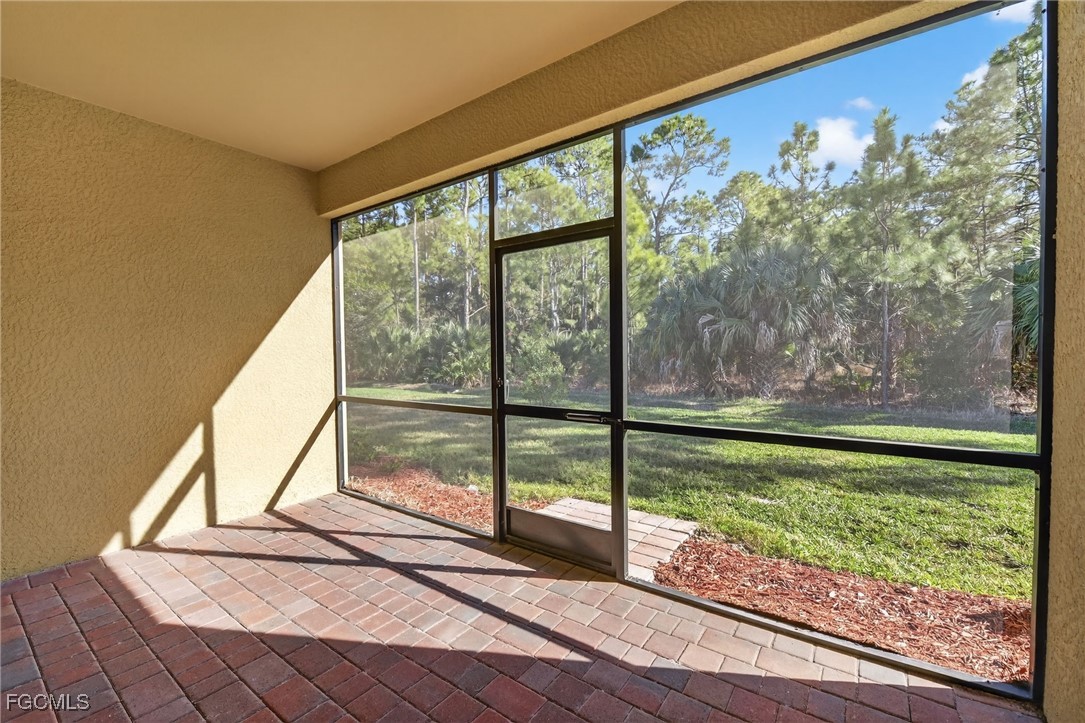 17364 Walnut Run Drive Alva, FL 33920 - Photo 45 of 50 a view of a floor to ceiling window next to a yard