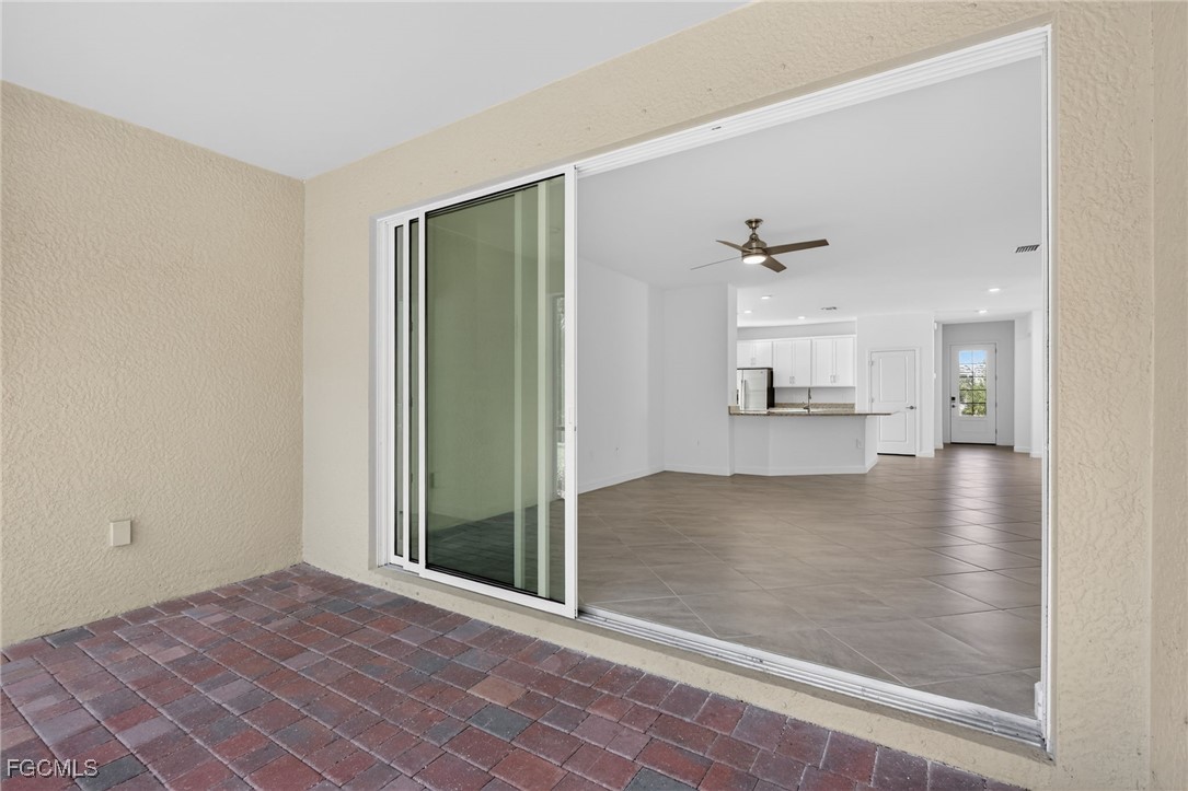 17364 Walnut Run Drive Alva, FL 33920 - Photo 46 of 50 an empty room with windows and entrance