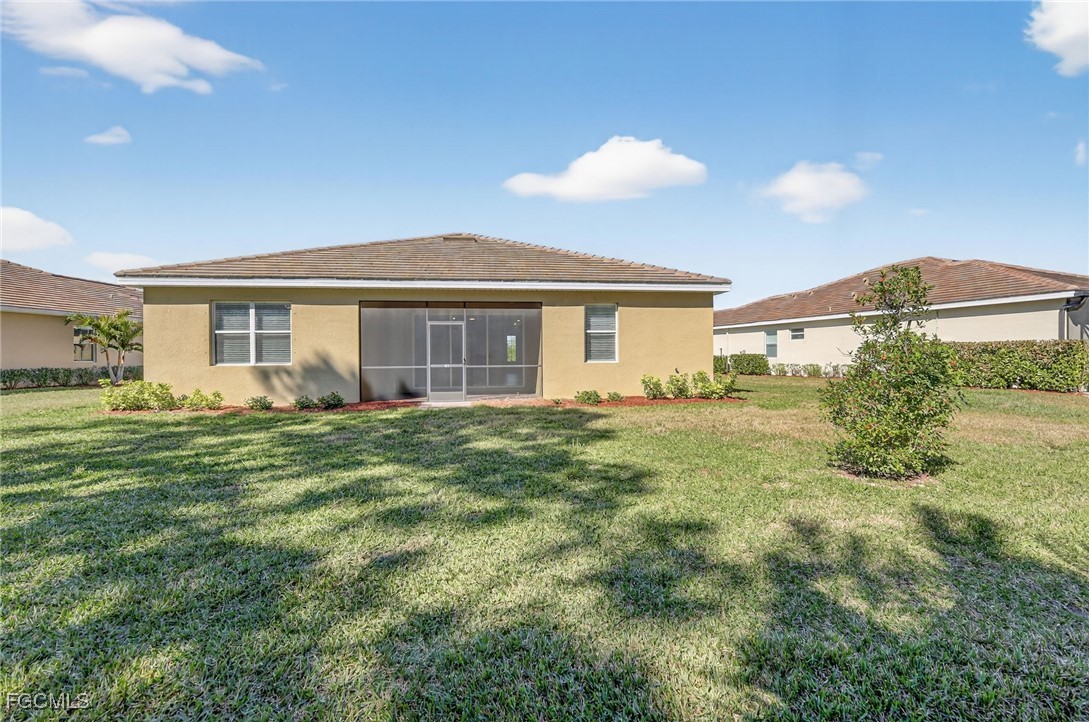 17364 Walnut Run Drive Alva, FL 33920 - Photo 49 of 50 a view of a house with a backyard