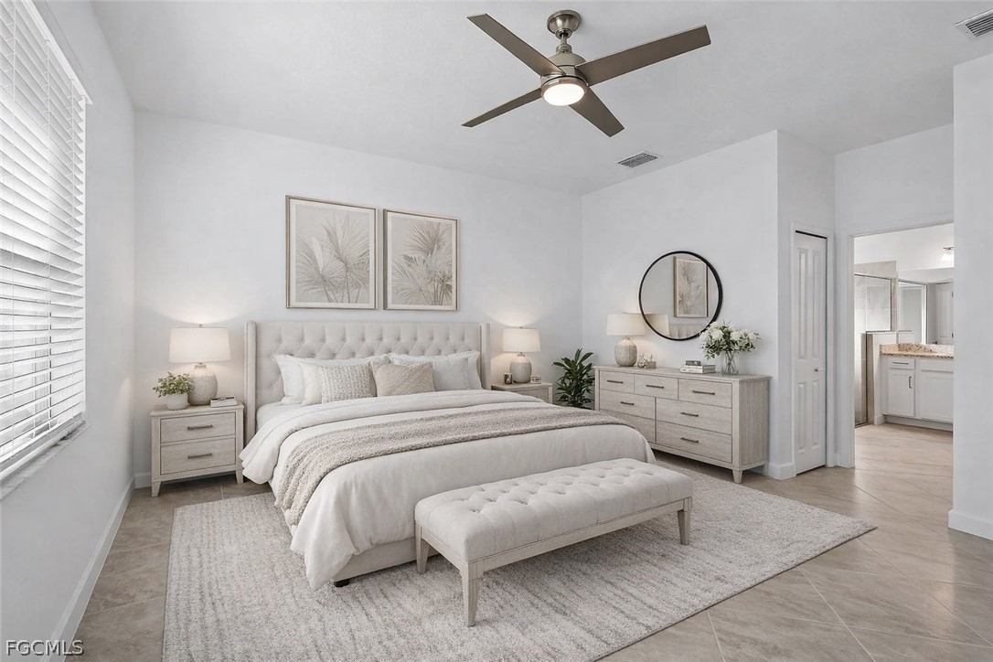 17364 Walnut Run Drive Alva, FL 33920 - Photo 8 of 50 a bedroom with a large bed and a chandelier