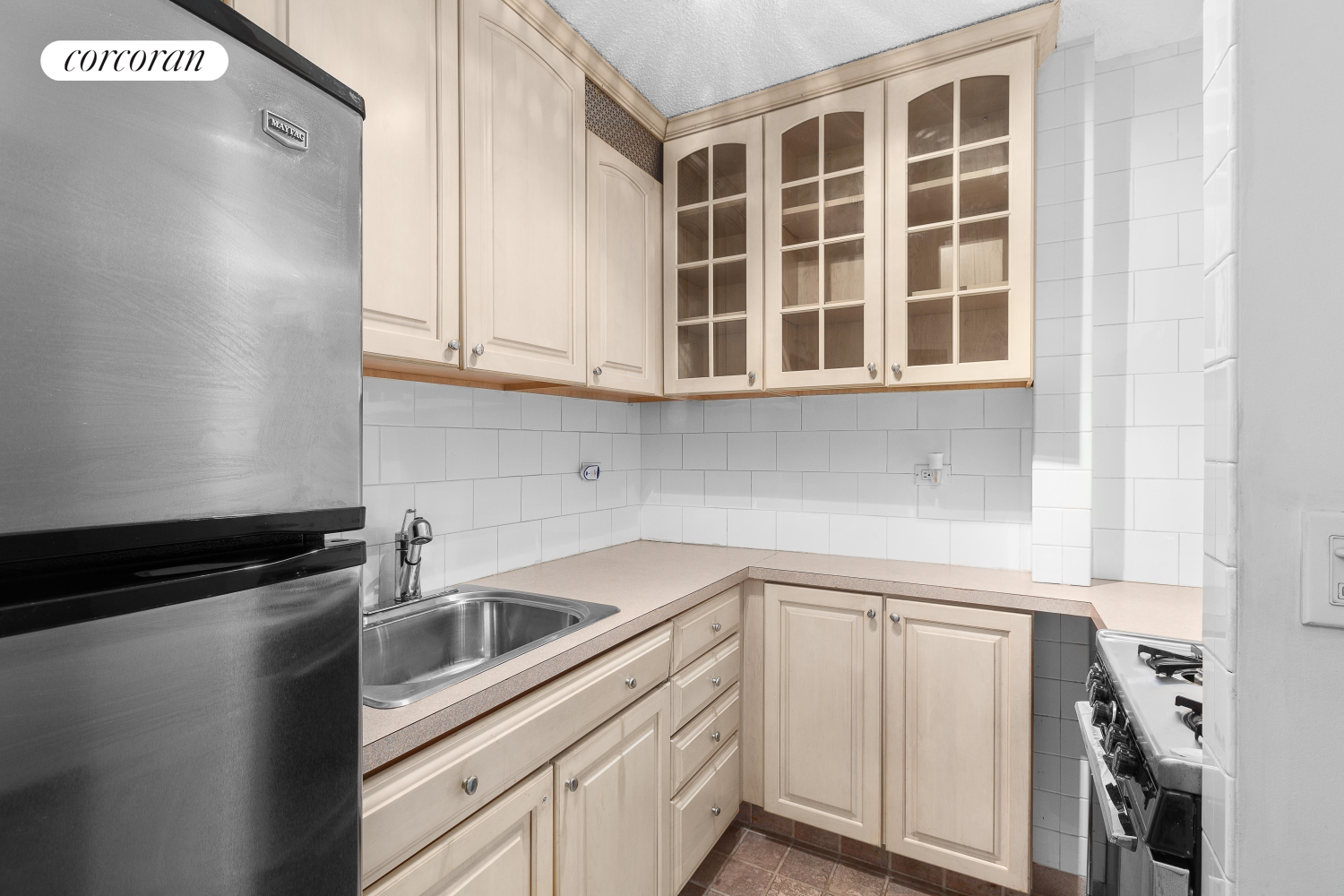 230 East 15th Street, Unit 3K Manhattan, NY 10003 - Photo 4 of 5 a kitchen with a sink and cabinets