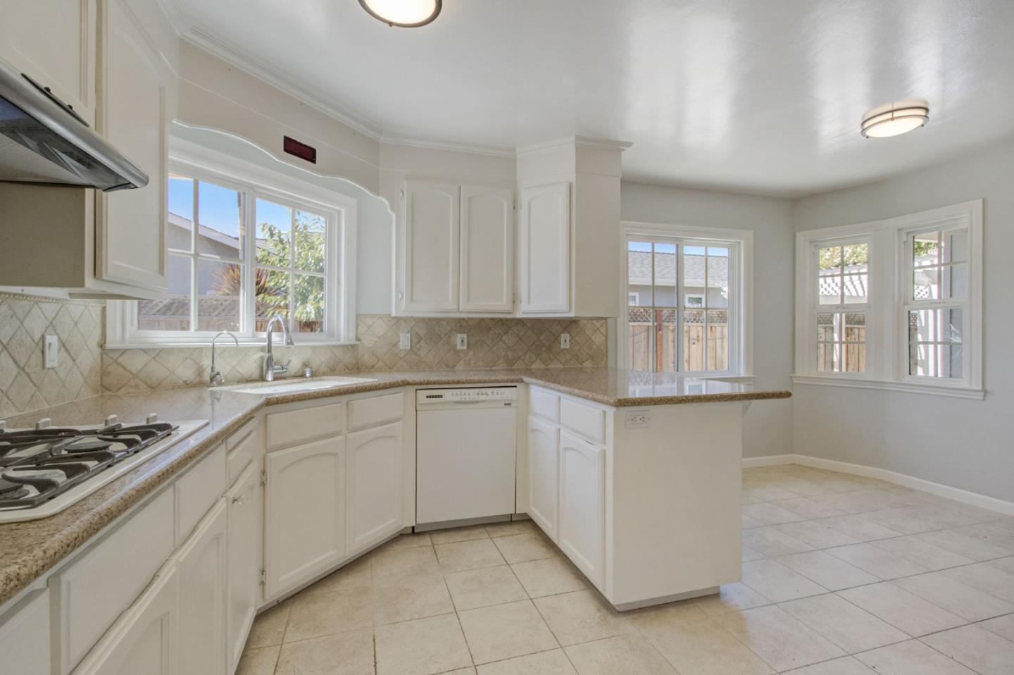 613 North Central Avenue Campbell, CA 95008 - Photo 17 of 66 a kitchen with granite countertop a sink and a stove