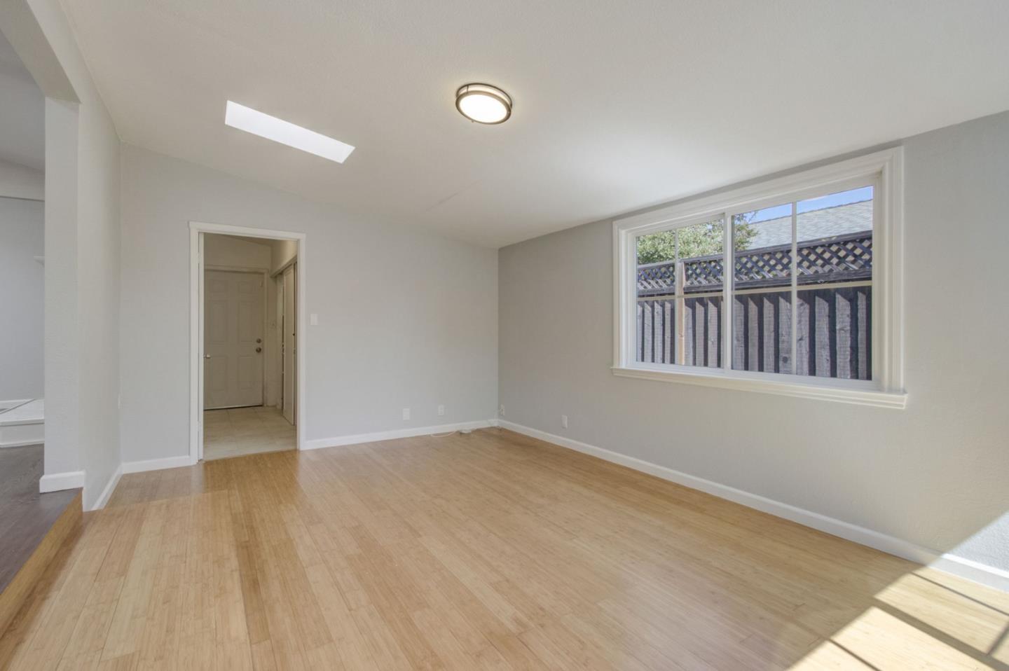 613 North Central Avenue Campbell, CA 95008 - Photo 22 of 66 a view of an empty room with wooden floor and a window