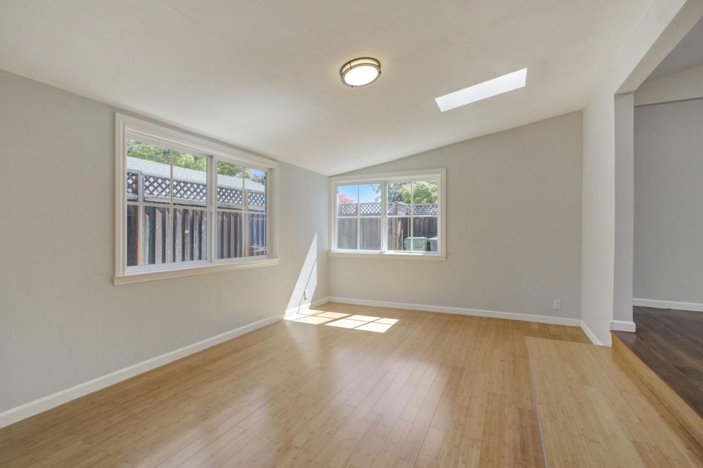 613 North Central Avenue Campbell, CA 95008 - Photo 25 of 66 a view of an empty room with wooden floor and a window