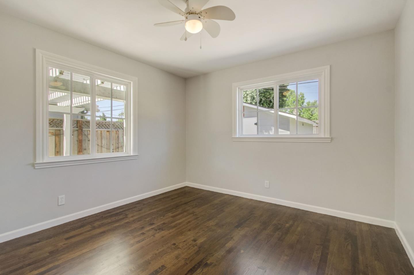613 North Central Avenue Campbell, CA 95008 - Photo 32 of 66 a view of an empty room with wooden floor and a window