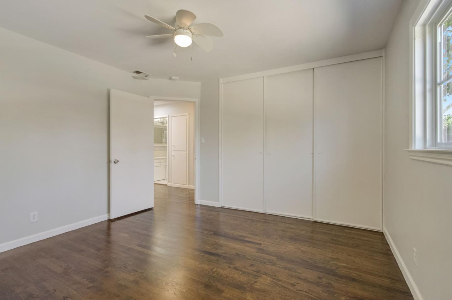 613 North Central Avenue Campbell, CA 95008 - Photo 35 of 66 an empty room with wooden floor and windows