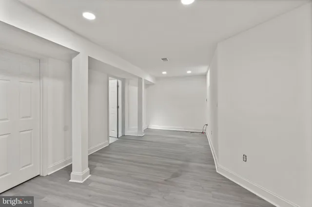 a view of a car park in front of house