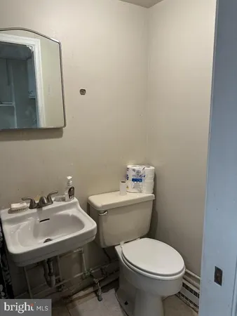 a kitchen with white cabinets and a sink