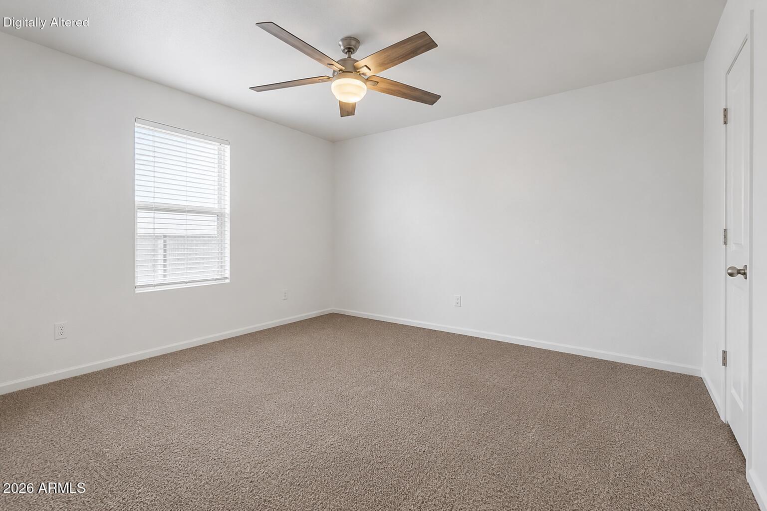 625 West McKellips Road, Unit 55 Mesa, AZ 85201 - Photo 13 of 21 an empty room with a window and a ceiling fan