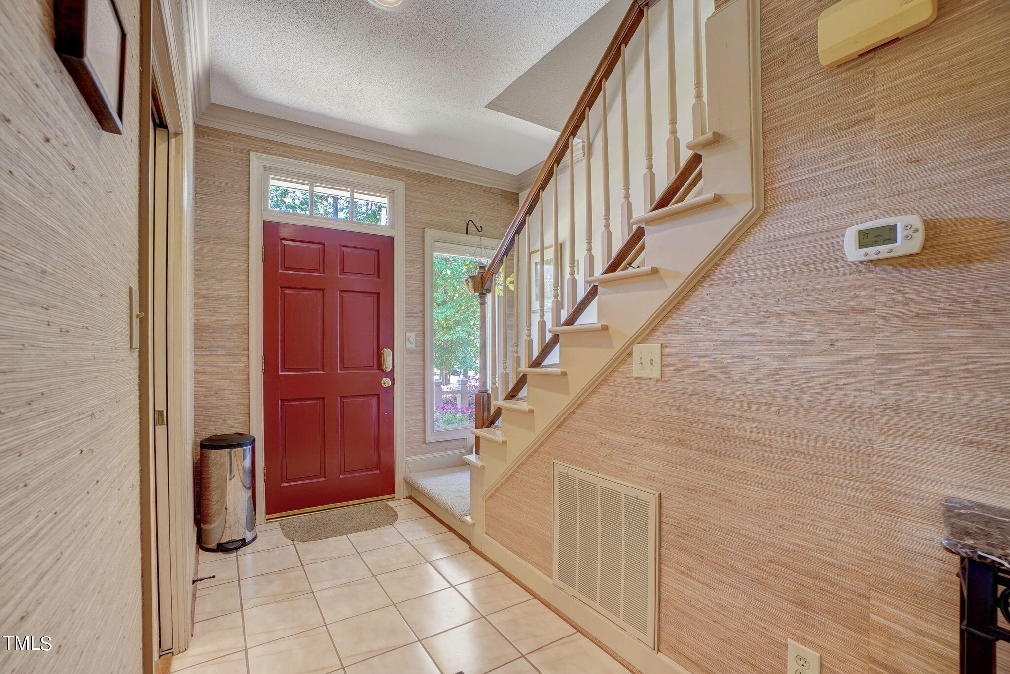 7931 Footman Way Raleigh, NC 27615 - Photo 5 of 33 a view of entryway with stairs