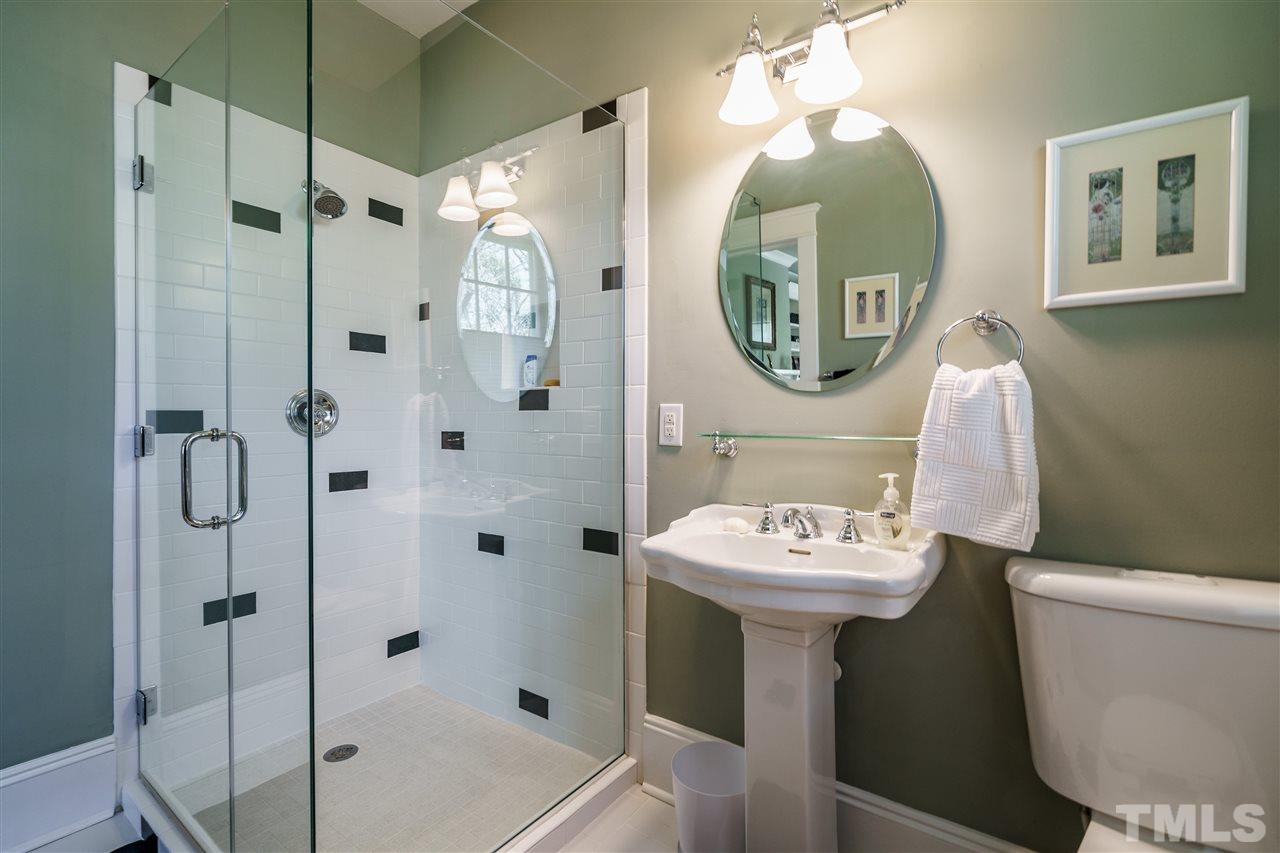 617 Elm Street Raleigh, NC 27604 - Photo 14 of 26 a bathroom with a sink mirror toilet and shower