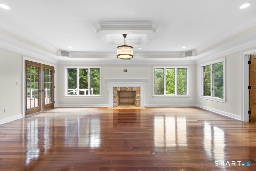 49 Partridge Lane Middletown, CT 06457 - Photo 8 of 39 a view of an empty room with wooden floor and a window
