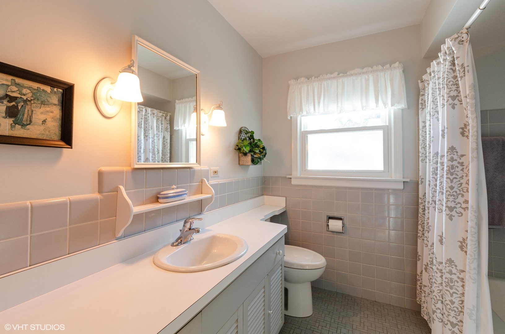 830 Warrington Road Deerfield, IL 60015 - Photo 12 of 15 a bathroom with a granite countertop sink a toilet and a mirror